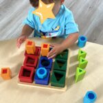 a kid playing with block toys
